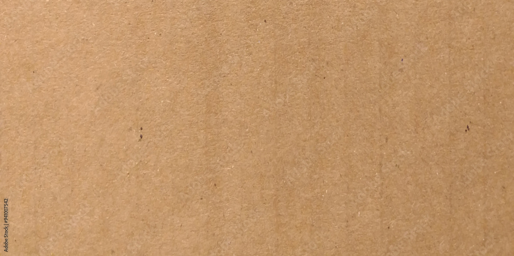 Fototapeta premium Brown eco recycled kraft paper sheet texture cardboard background. Close up natural brown paper parchment background texture with dark nap fibers pattern for design craft