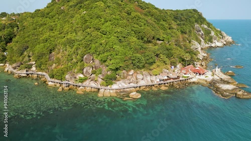 Aerial view of a tropical island showcases lush greenery and clear, inviting waters. Haad Rin, Koh Phangan island, Thailand photo