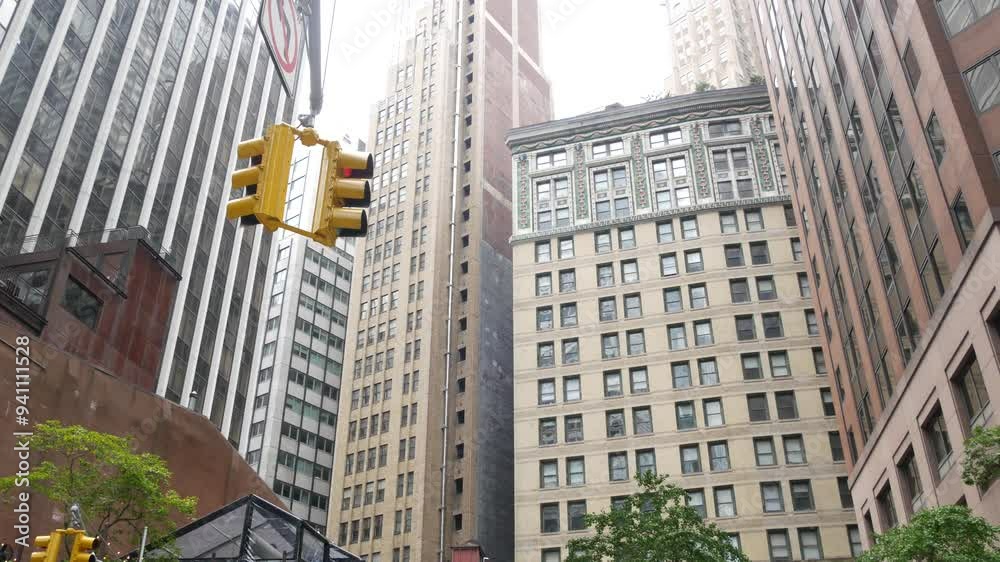 New York City Water street crossroad, yellow traffic light, transport road intersection, United States. NYC Lower Manhattan, downtown financial business district. Highrise skyscrapers. Gouverneur Ln.