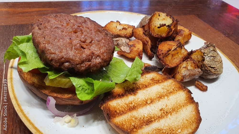 Open Burger on a Plate with Side of Crispy Potatoes – A Delicious Meal Open Burger on a Plate with Side of Crispy Potatoes – A Delicious Meal