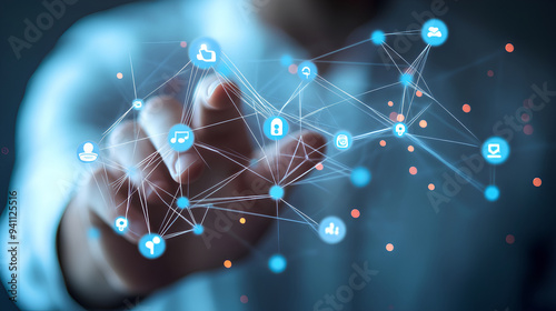 Close-up image of a person's hand interacting with a futuristic screen.