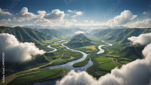 An aerial perspective of a river meandering through a verdant valley beneath a blue sky adorned with fluffy white clouds. photo