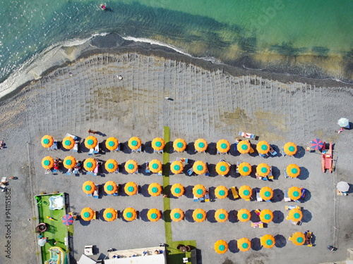 Aerial view of the coast of Liguria (Italy) with its sea, beaches and parasols