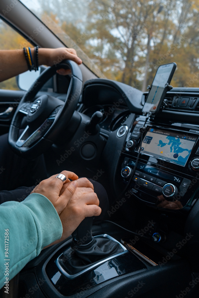 couple holding hands in road trip