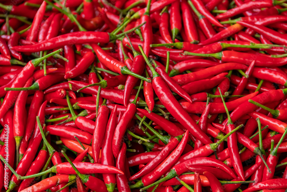 Pile of red spicy chili peppers at fresh market in Thailand. Pile of red spicy chili peppers at fresh market in Thailand.