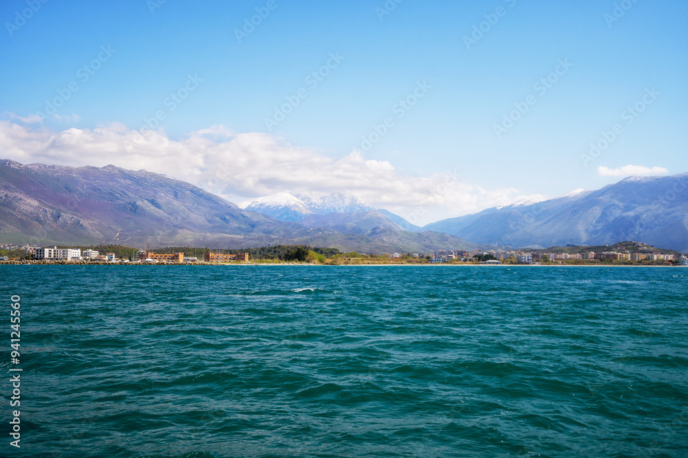 City beach of Vlora resort town, Albania. Summer sunny day. View of the city and the adriatic sea