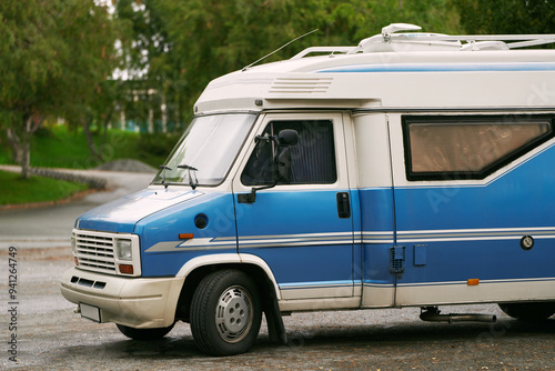 Blue RV parked in a peaceful natural spot
