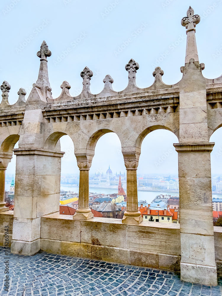 Fototapeta premium The view through the windows of the arcade at Fisherman's Bastion in Budapest, Hungary