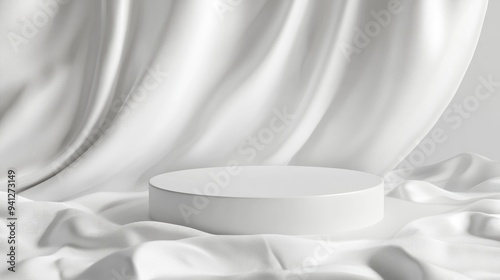 3D render of a white podium for product display placed on smooth white satin fabric