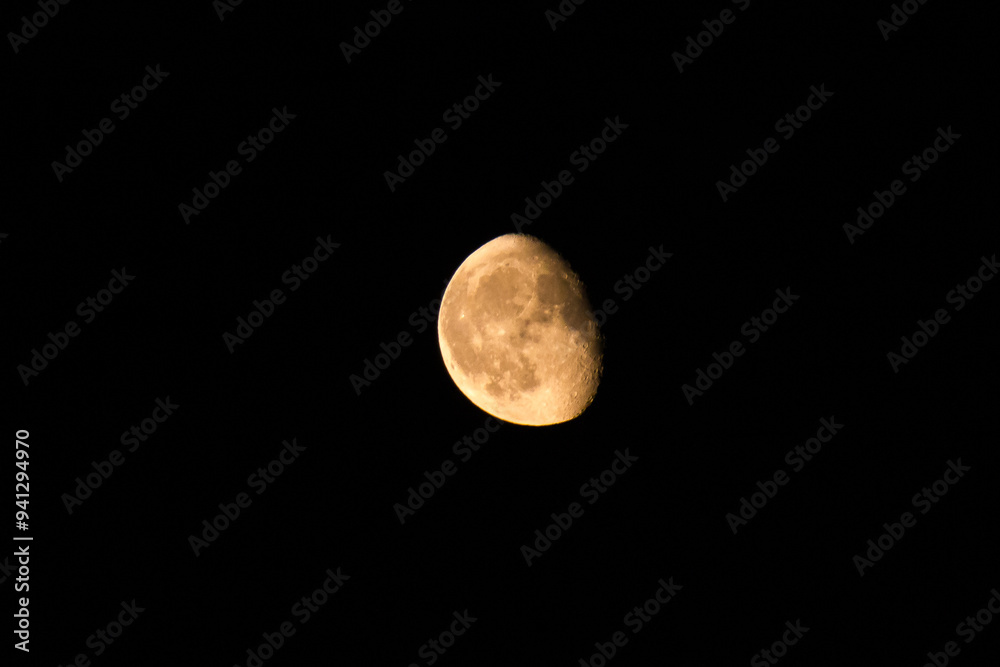 Night shot of the Moon in a black sky. Night shot of the Moon in a black sky.