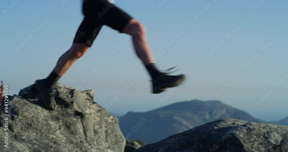 Man, hiker and exercise on mountain to explore, legs and peak with backpack. Hiking fitness and climber for training, workout and nature for adventure, hobby and summit kilimanjaro for freedom Man, hiker and exercise on mountain to explore, legs and peak with backpack. Hiking fitness and climber for training, workout and nature for adventure, hobby and summit kilimanjaro for freedom