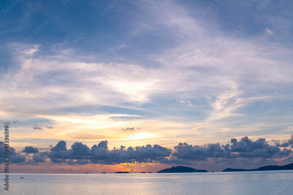 Fototapeta premium sunset or sunrise seascape on koh Lipe isaland with gold lighting sunset sky background