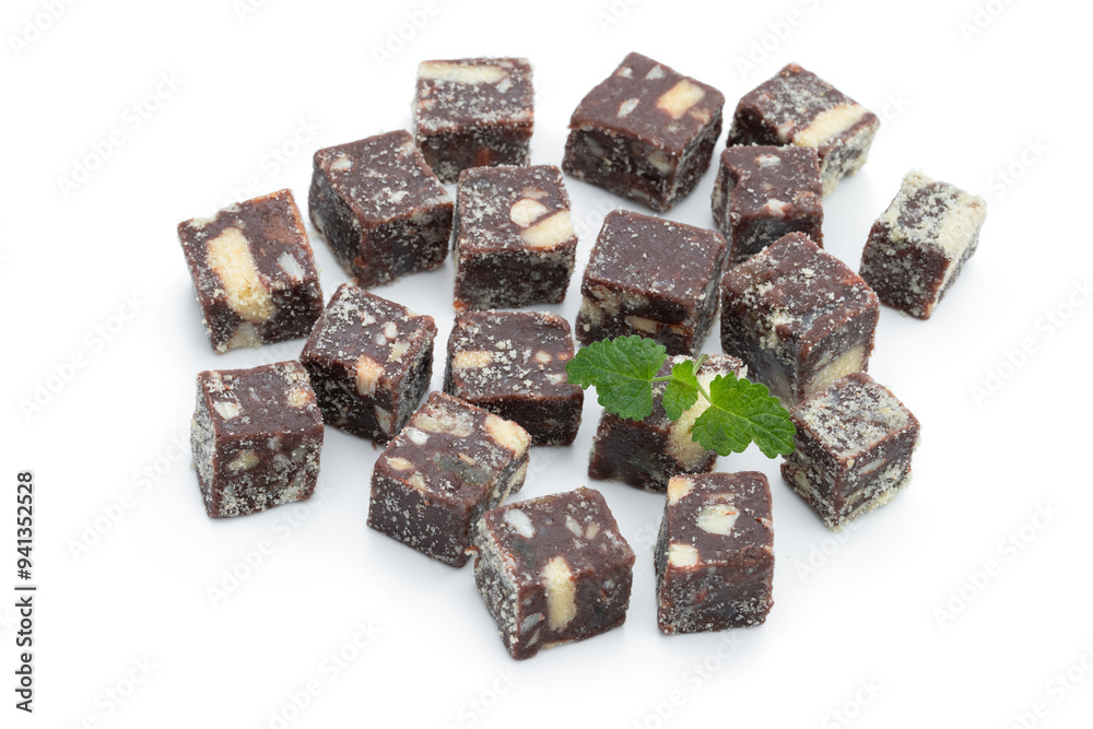 Chocolate cubes with nuts and cookies isolated on white Chocolate cubes with nuts and cookies isolated on white