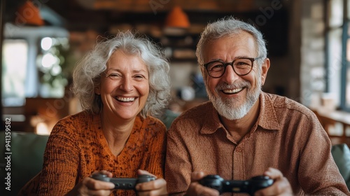 Older couple laughing together as they try to master a new video game, highlighting the fun of learning new skills.