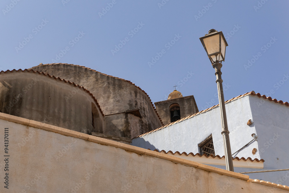 Prato Church Sardinia. Church tower as seen from the street in the old town of Prato in Sardinia.