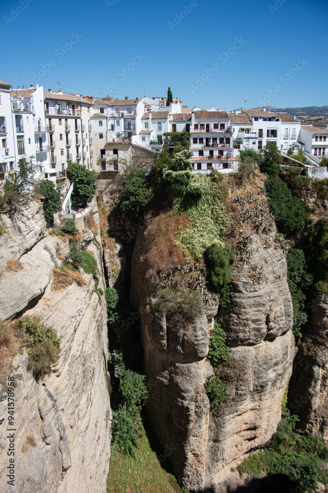 The cliffside location of Ronda overlooking the deep canyon that is part of the Guadalevin river. The cliffside location of Ronda overlooking the deep canyon that is part of the Guadalevin river.