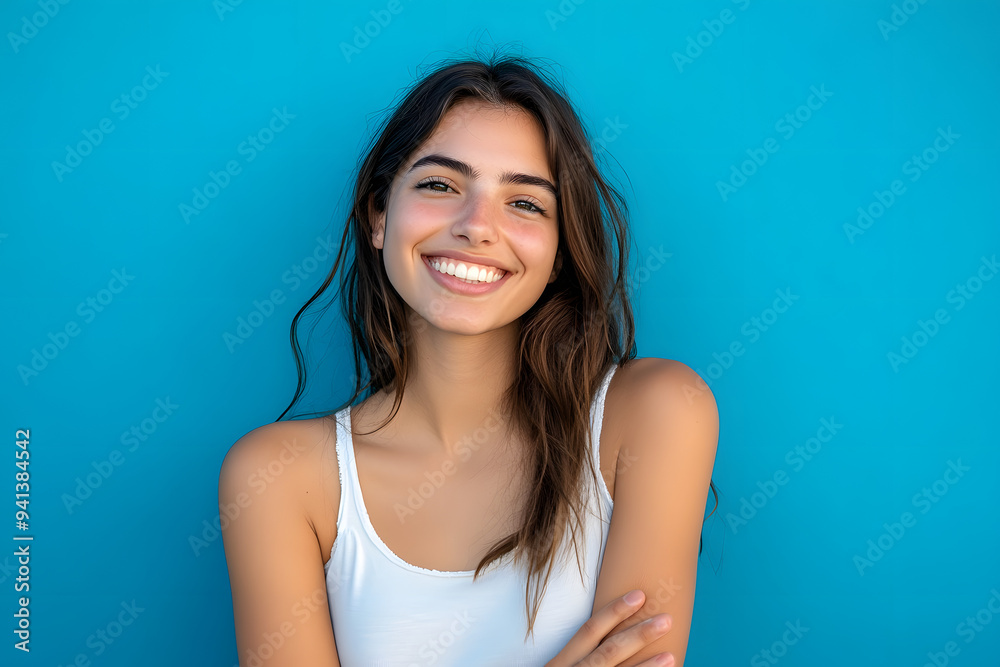Young woman over isolated blue background smiling Young woman over isolated blue background smiling