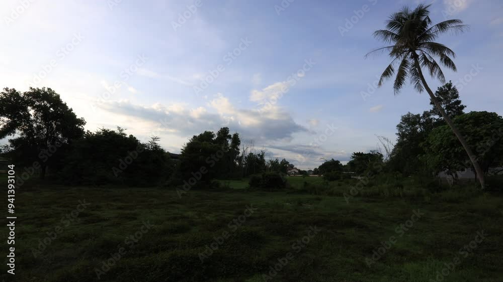 natural background of the evening atmosphere of a house in a rural community, with the changing light of the sky, the cloudy weather during the rainy season, the wind blowing through in a cool blur natural background of the evening atmosphere of a house in a rural community, with the changing light of the sky, the cloudy weather during the rainy season, the wind blowing through in a cool blur