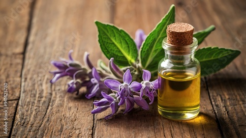 a small bottle of clary sage essential oil isolated background