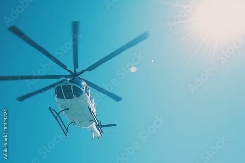 Helicopter in Flight Under Bright Sun with Clear Blue Sky