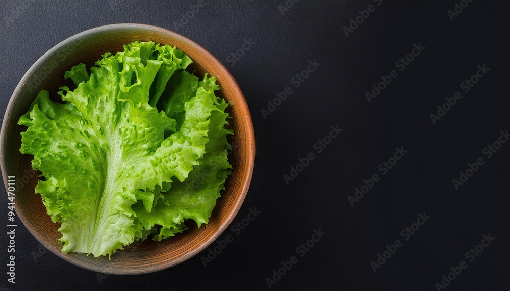 lettuce in a bowl on a black background, top view lettuce in a bowl on a black background, top view