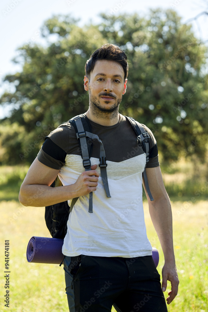 Fototapeta premium backpacker facing the camera in nature