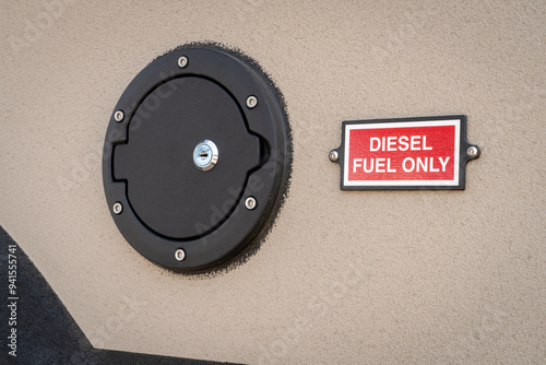 fuel filler inlet on a truck or van with diesel fuel only alert sign photo