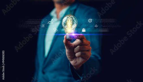 Obraz na płótnie Hand of man holding illuminated light bulb, Idea innovation and inspiration concept. new ideas Great inspiration and innovation new beginning w salonie