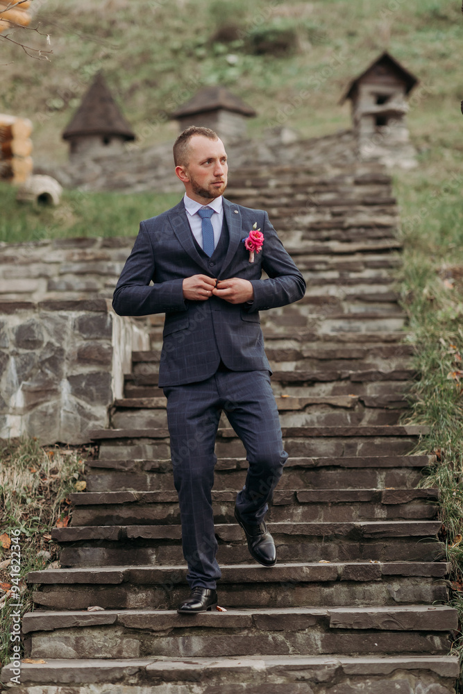 A man in a suit is walking up a set of stairs A man in a suit is walking up a set of stairs