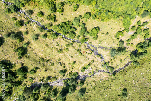 Wallpaper Mural Aerial View of Mountainous Terrain with Stream Torontodigital.ca