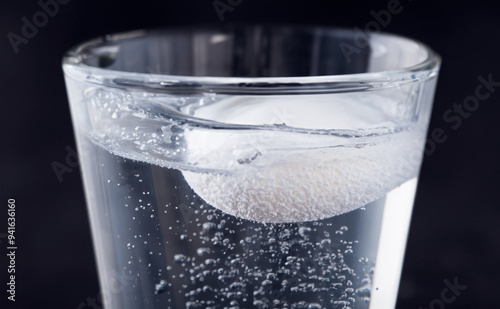 effervescent tablet in a glass of water