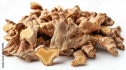 Pile of dried ginger roots isolated on a white background 