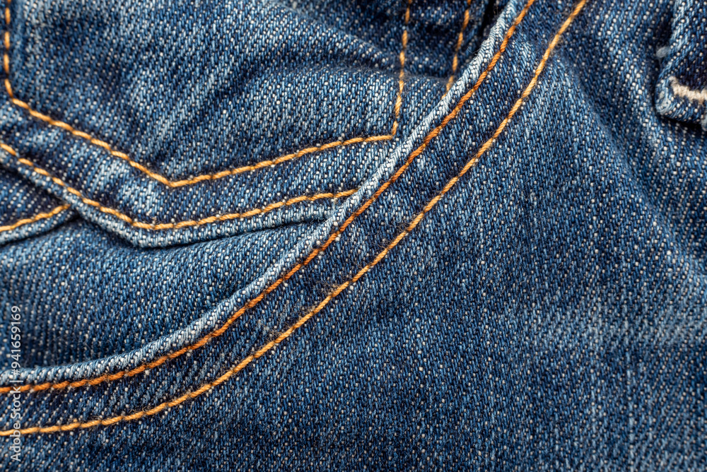 Jeans texture with seams close-up. Denim background. Seam Jeans texture with seams close-up. Denim background. Seam