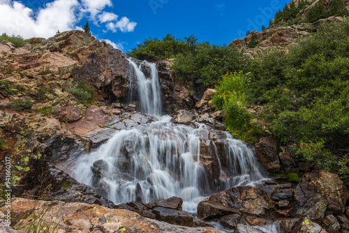 mountain river waterfall long exposure in the summer afternoon