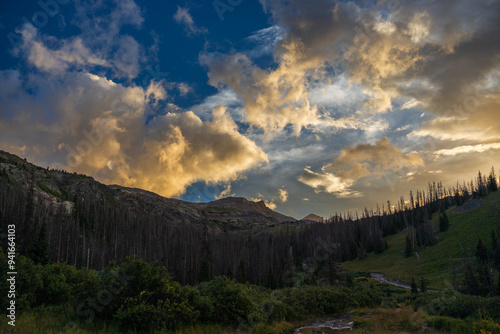 Sunset in the mountains with dramatic clouds