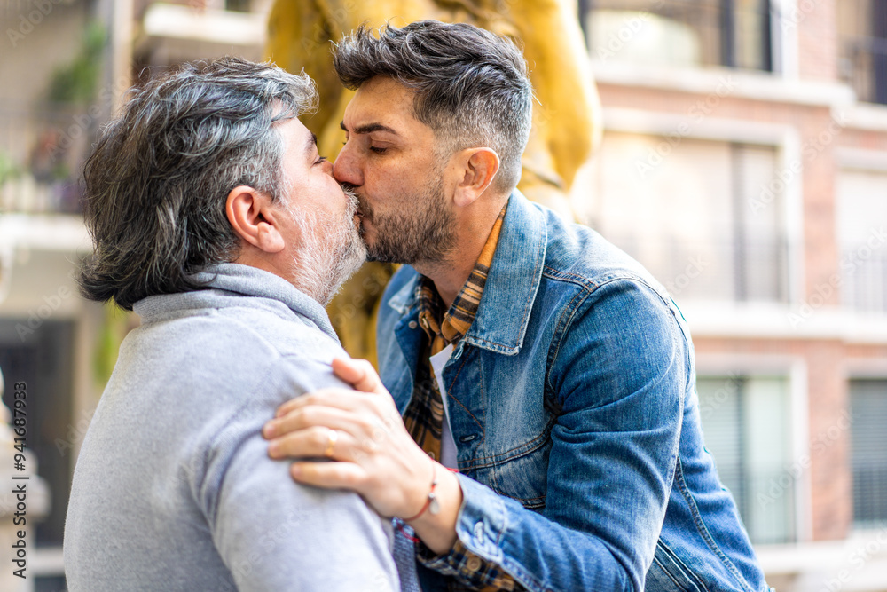 Gay couple kissing passionately outdoors Gay couple kissing passionately outdoors