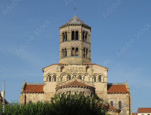 Romanesque Abbey of Saint-Austremoine. Issoire. Auvergne. France. 12th century. General view of the apses and the bell tower.  photo