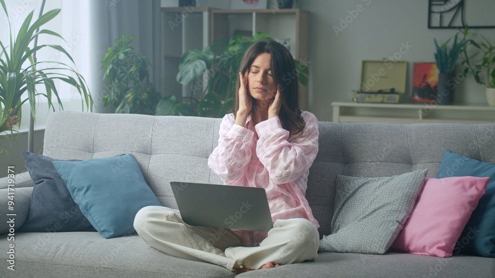 Young woman suffering from headache working from Young woman suffering from headache working from