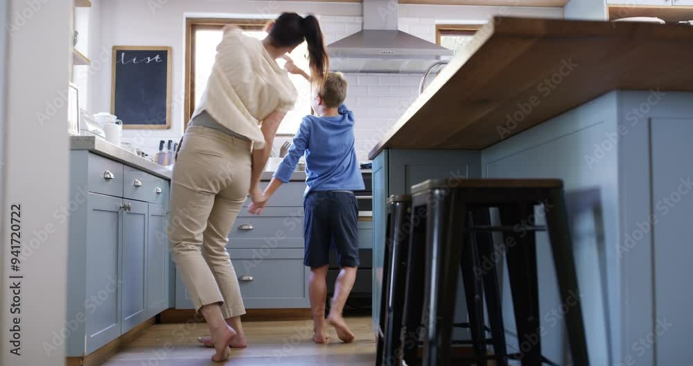 Mother, child and holding hands for dancing, happy together and bonding on vacation in home. Woman, son or parent care in smile for health wellness, weekend leisure or holiday fun to relax in house