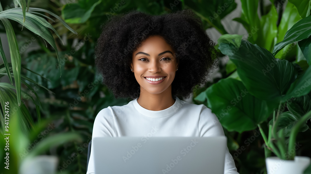 Cheerful employee working at a desk with ergonomic setup calm ambiance plants nearby well-lit space emphasizing wellness and comfort positive energy promoting mental health 