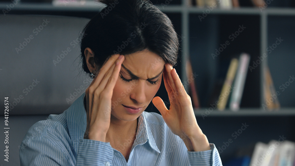 Businesswoman having strong headache touching Businesswoman having strong headache touching