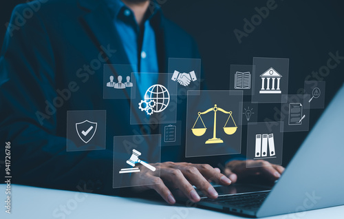Legal Professional with Justice Icons. Legal professional using laptop with virtual icons symbolizing law, justice, and legal services. business legislation, Notary public, legal advice online, Lawyer photo