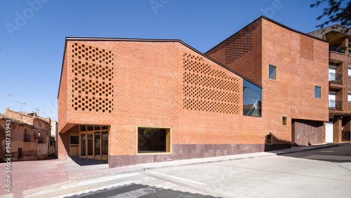 Modern auditorium exterior with distinctive brick design photo