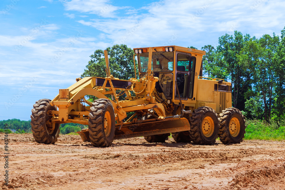 Having to work at construction site with heavy earthmoving construction grader tractor Having to work at construction site with heavy earthmoving construction grader tractor