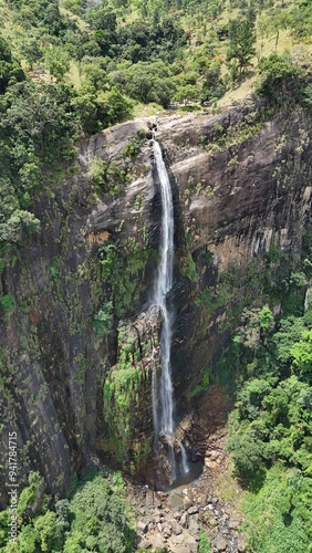 Waterfall in the jungle with natural pools on top. Drone view. Diyaluma Waterfall, Sri Lanka. photo