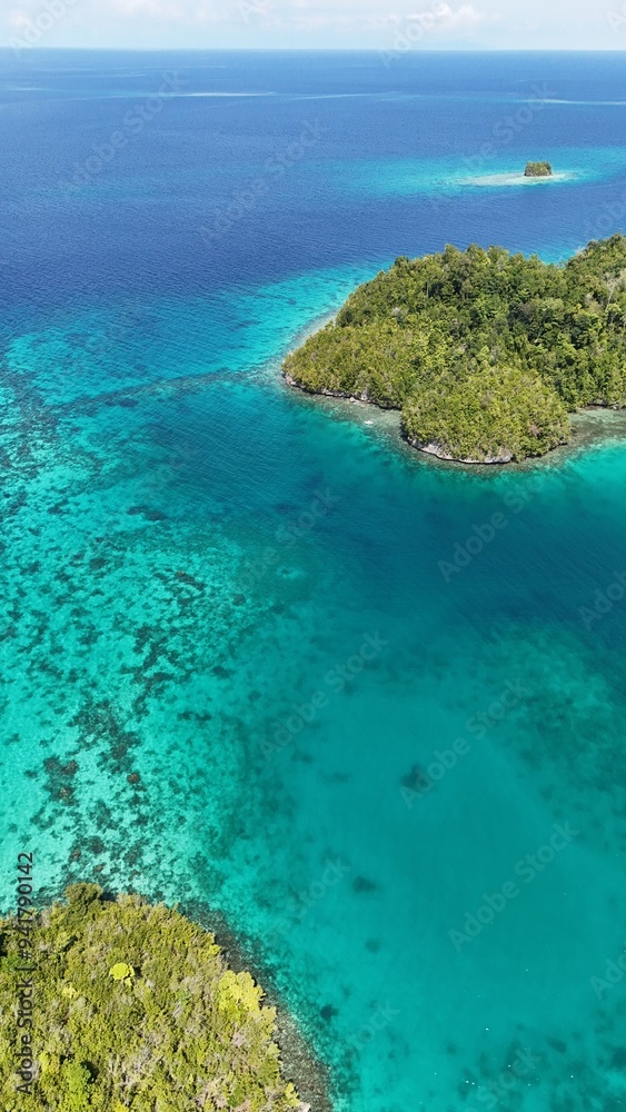 Tropical ocean lagoon with clear blue beautiful water and coral reef. Togean National Park, Central Sulawesi, Indonesia. Tropical ocean lagoon with clear blue beautiful water and coral reef. Togean National Park, Central Sulawesi, Indonesia.