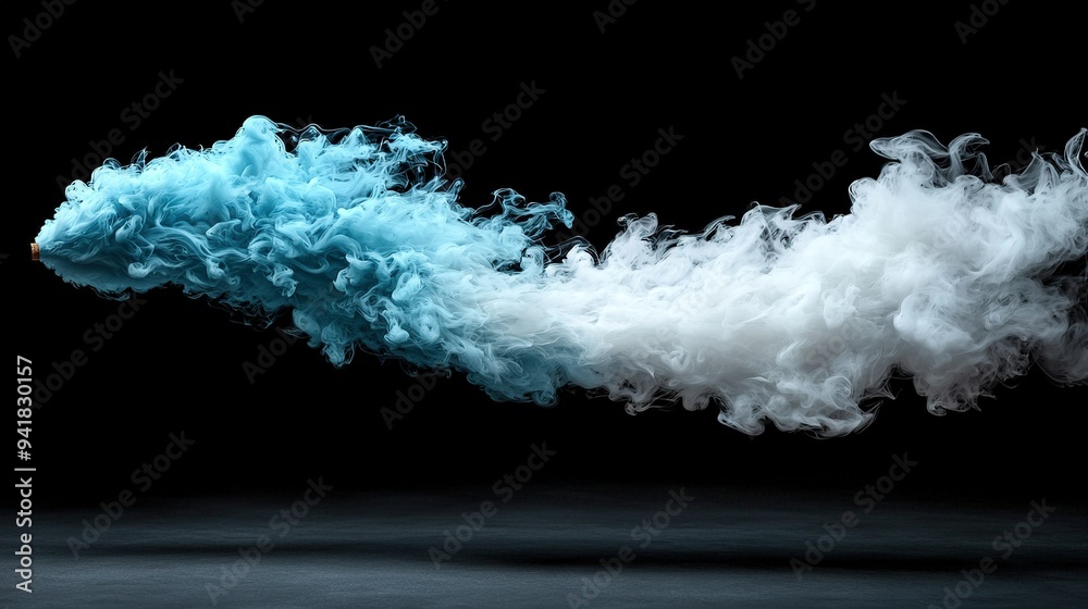 A blue and white cloud of smoke in the shape of an arrow on a black background A blue and white cloud of smoke in the shape of an arrow on a black background