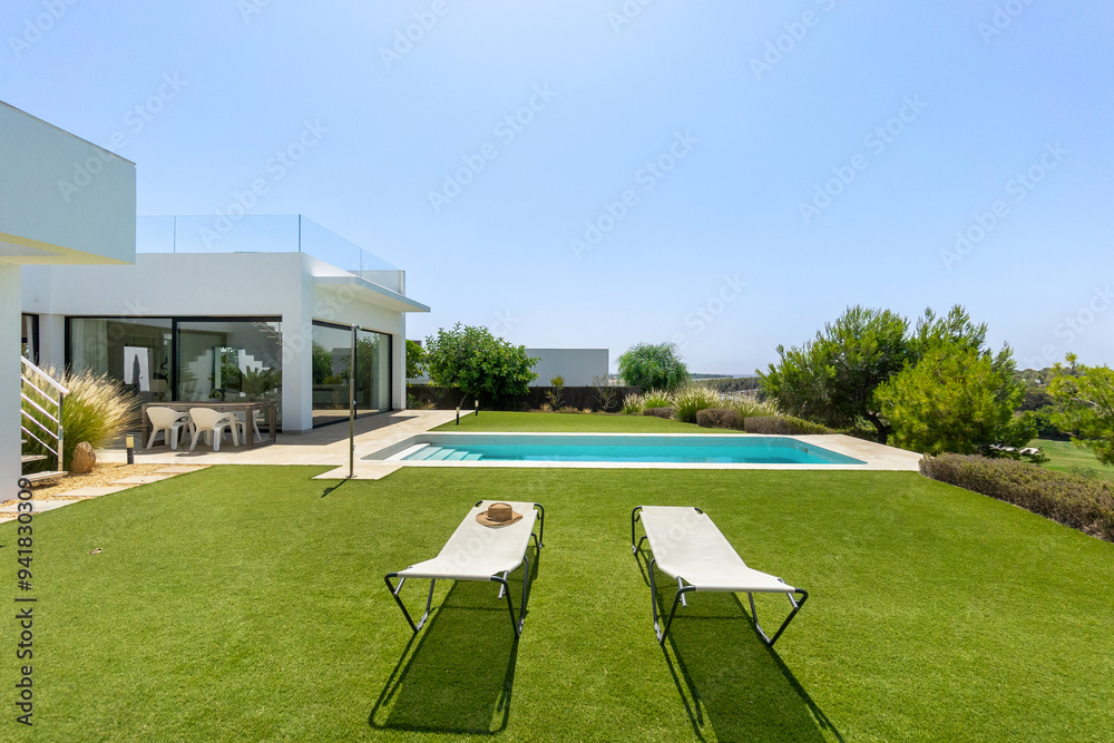 custom made wallpaper toronto digitalModern home with pool and lush garden on a sunny day