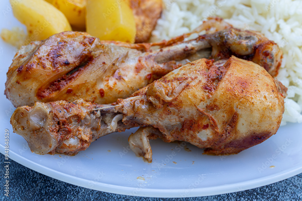 oven-fried chicken legs, french fries and rice pilaf.