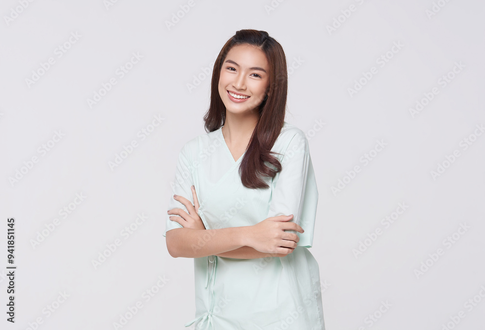 Happy asian woman patient arms crossed isolated on white studio background. life insurance and coverage concept. Happy asian woman patient arms crossed isolated on white studio background. life insurance and coverage concept.